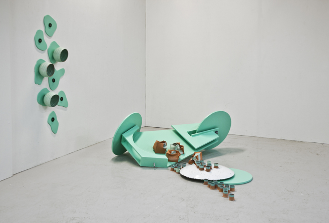 Ceramic installations inspired by childhood soapbox cars, exploring time, memory, and space at Gallery 21 in Malmö. 9