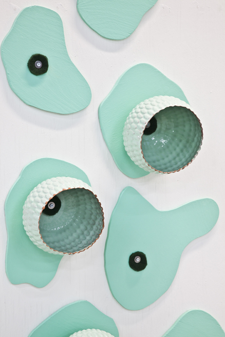 Ceramic installations inspired by childhood soapbox cars, exploring time, memory, and space at Gallery 21 in Malmö. 8