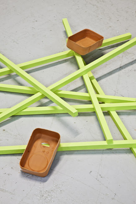 Ceramic installations inspired by childhood soapbox cars, exploring time, memory, and space at Gallery 21 in Malmö. 17